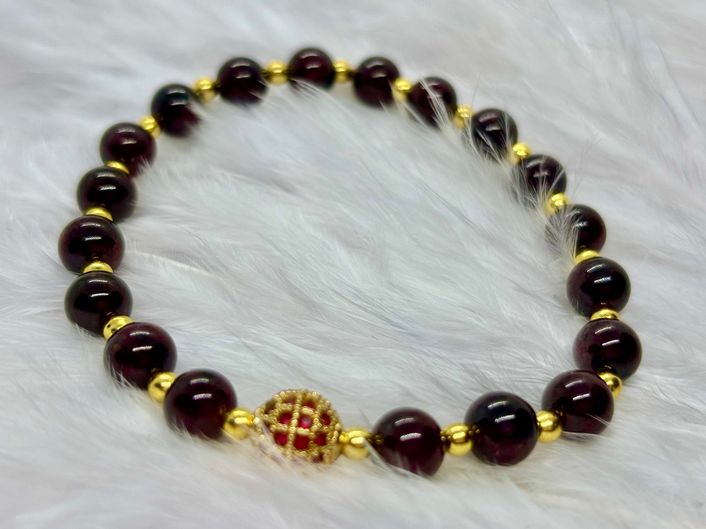 Garnet is the flame of life itself — a stone of passion, power, and renewal