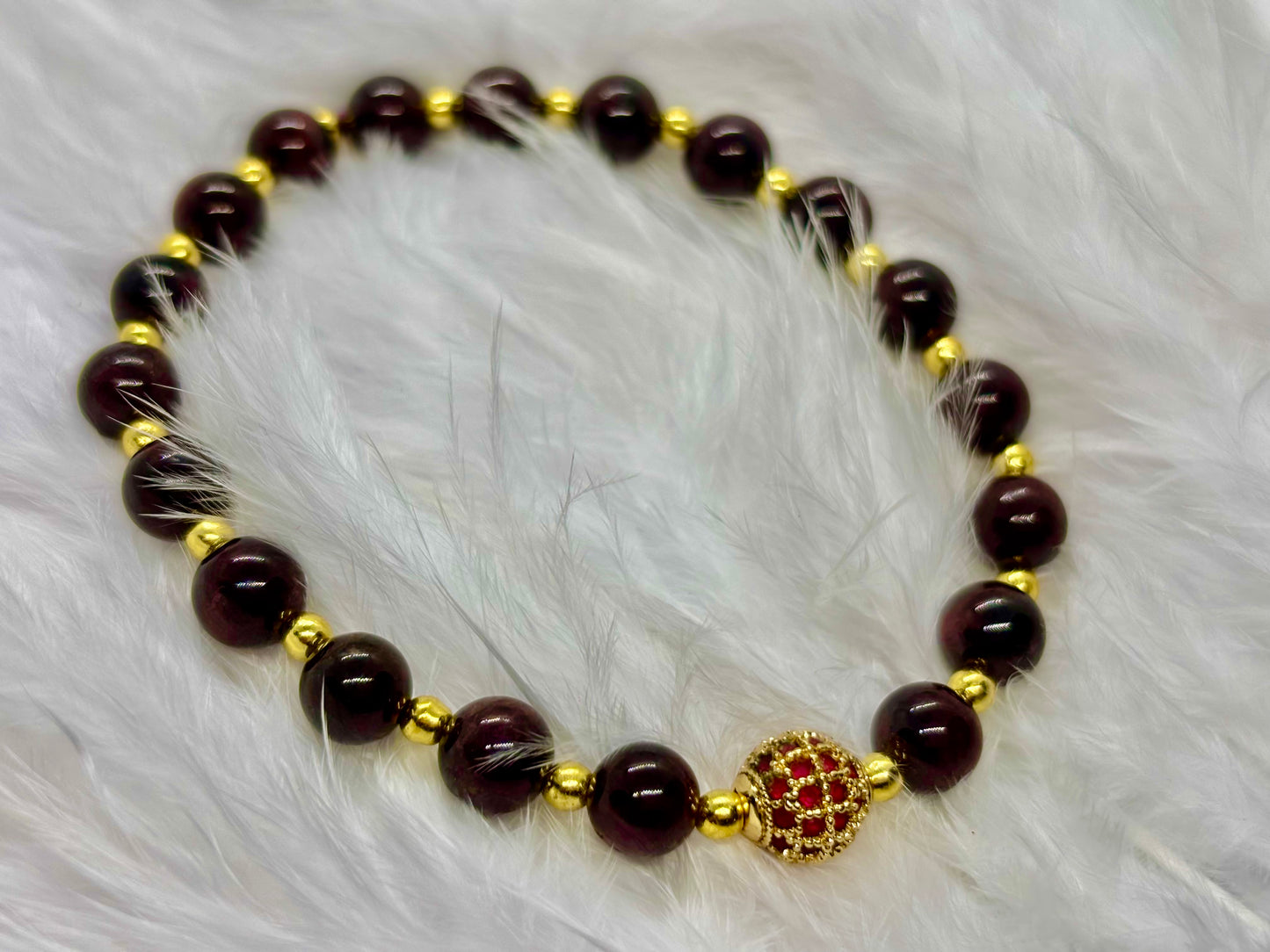 Garnet is the flame of life itself — a stone of passion, power, and renewal